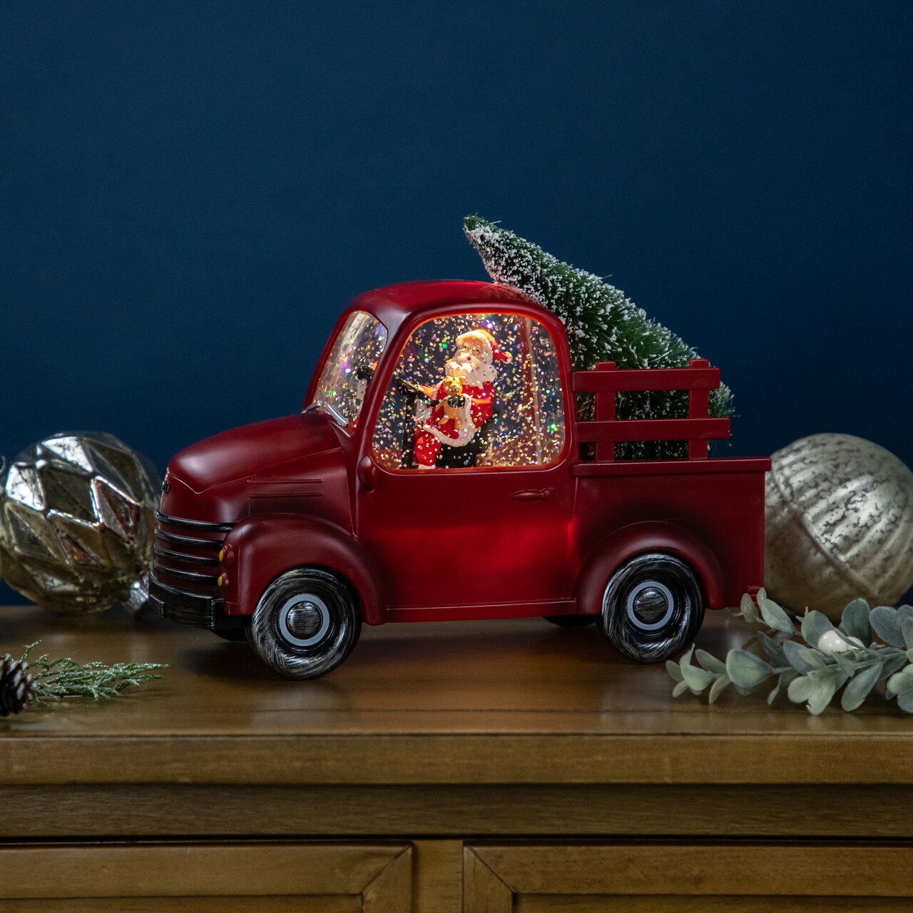 Northlight LED Lighted Santa in Red Retro Truck with Christmas Tree Snow Globe - 9"